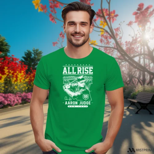 New York Yankees Aaron Judge All Rise Men’s Irish Green T Shirt – Male Model in Gray Office Male Model Wearing New York Yankees Aaron Judge All Rise Men's Irish Green T Shirt in a gray office environment. Features a classic crew neck tee.
