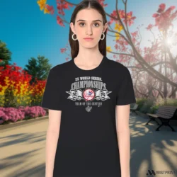 Female Model Wearing 1999 New York Yankees Team Of The Century Women's Black T Shirt in a gray office environment. Features a classic crew neck tee.