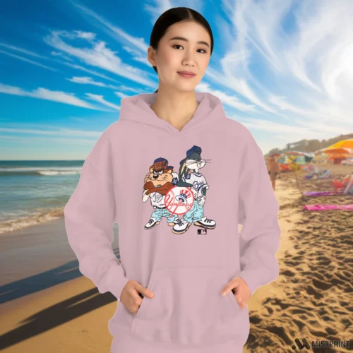 90s Taz Bugs Bunny New York Yankees Women’s Light Pink Hoodie – Female Model in White Office Female Model Wearing 90s Taz Bugs Bunny New York Yankees Women's Light Pink Hoodie in a white office environment. Features a cozy pullover hoodie.